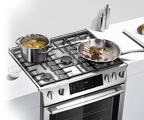 High-end gas range with precision burners and stainless steel finish, featuring modern appliance design